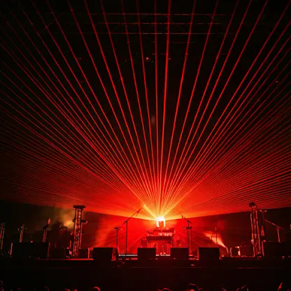 Electronic music festival stage with red lasers